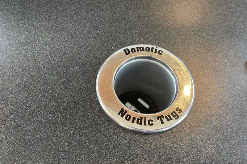 Spray Yacht Photos Pics Chrome cup holder on 2015 Nordic Tug 39 boat, branded "Dometic Nordic Tugs."