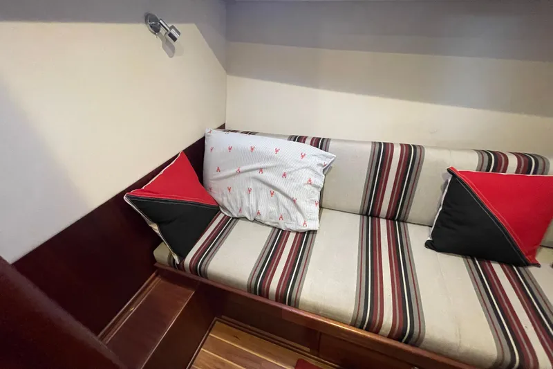 Spray Yacht Photos Pics Cozy interior seating with striped cushions on a 2015 Nordic Tug 39 boat.