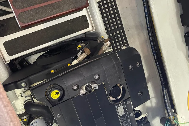 Spray Yacht Photos Pics Engine compartment of a 2015 Nordic Tug 39, showcasing mechanical components and hoses.