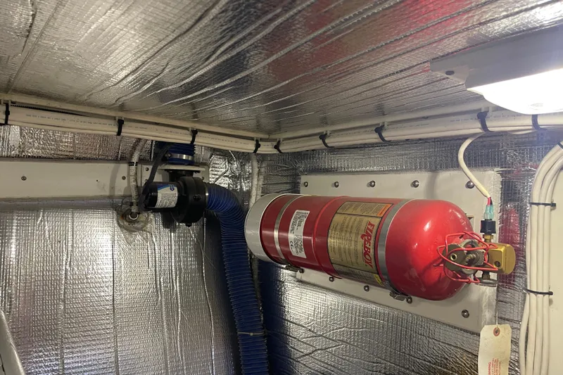 Spray Yacht Photos Pics Engine room of 2015 Nordic Tug 39 with fire extinguisher and insulated walls.