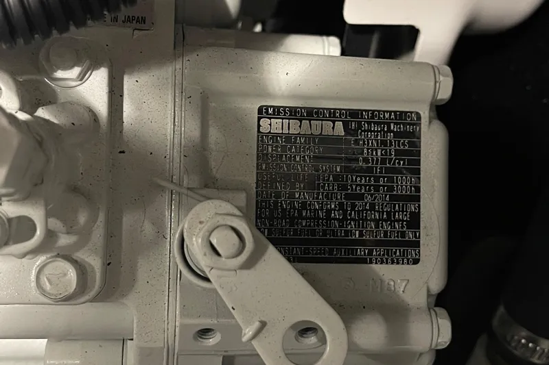 Spray Yacht Photos Pics Engine emission control label on a 2015 Nordic Tug 39, featuring Shibaura machinery details.