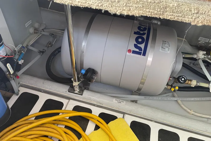 Spray Yacht Photos Pics Engine room of 2015 Nordic Tug 39 with Isotemp water heater and hoses.