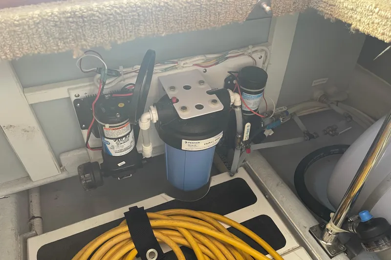 Spray Yacht Photos Pics Engine compartment of a 2015 Nordic Tug 39, featuring water filtration system and wiring.