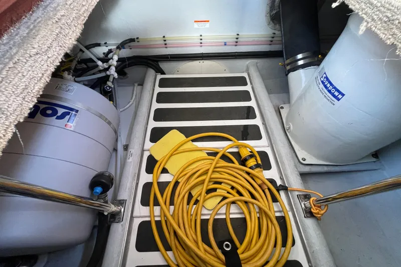 Spray Yacht Photos Pics Engine room of 2015 Nordic Tug 39 with equipment and coiled yellow cable.