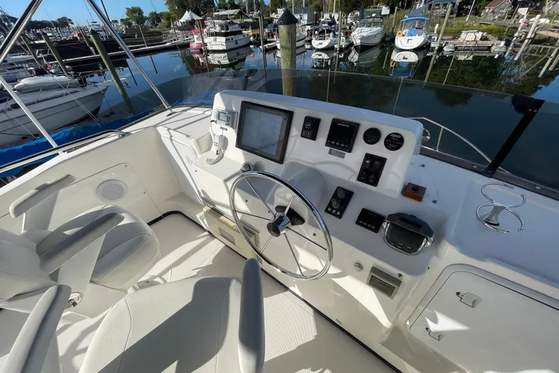Spray Yacht Photos Pics Helm of 2015 Nordic Tug 39 with navigation controls and marina view.