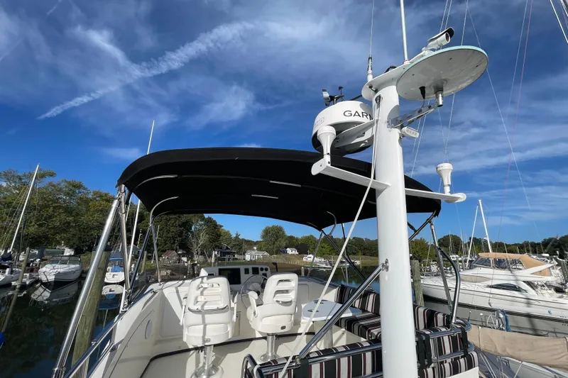 Spray Yacht Photos Pics 2015 Nordic Tug 39 with radar equipment, docked under clear blue skies.