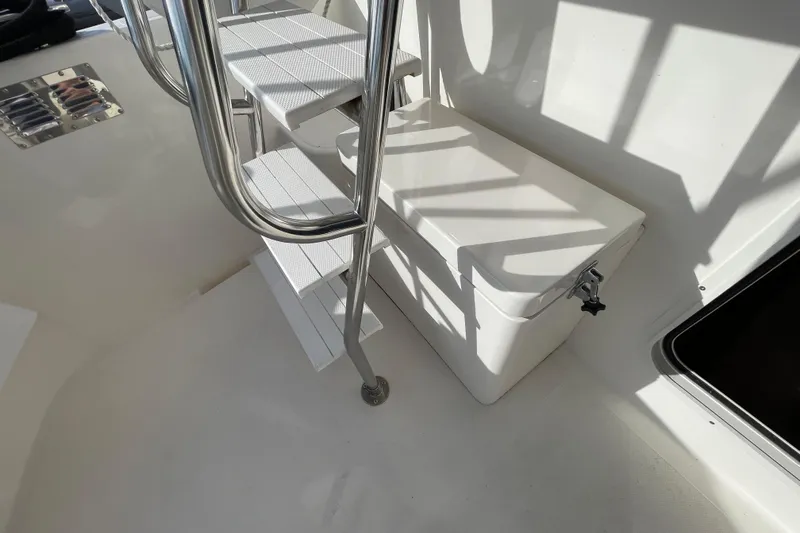 Spray Yacht Photos Pics Staircase and storage on 2015 Nordic Tug 39 boat deck, featuring stainless steel railings.