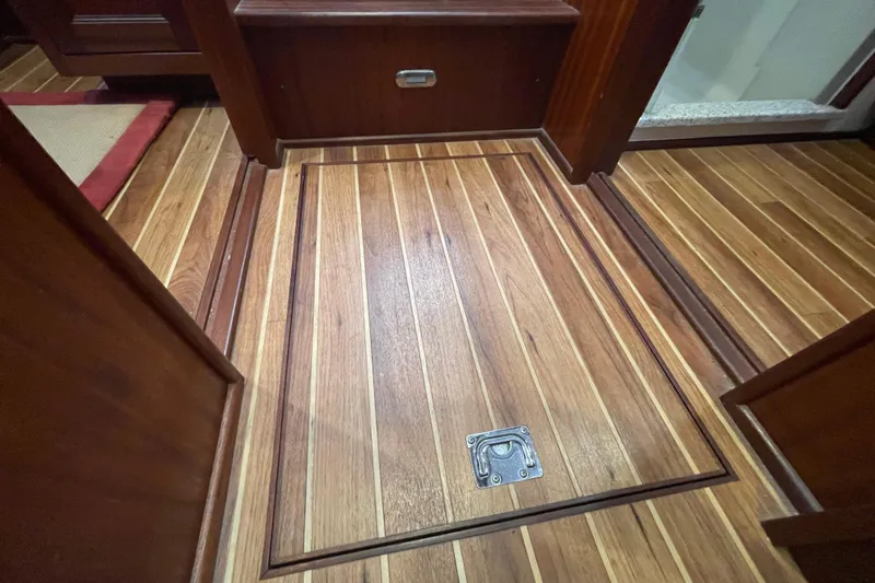 Spray Yacht Photos Pics Wooden interior ceiling of a 2015 Nordic Tug 39 boat, featuring a hatch with a metal handle.