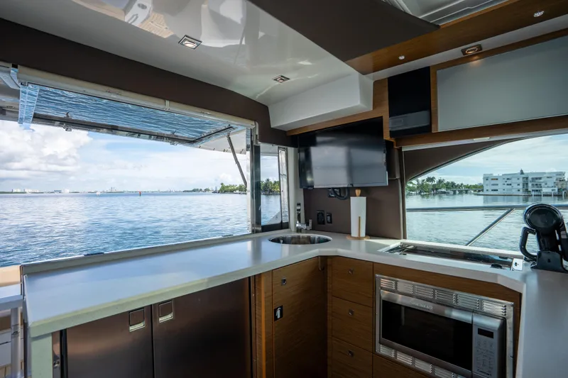 Chassan Yacht Photos Pics Luxurious 2016 Cruisers Cantius yacht kitchen with modern amenities and scenic water view.