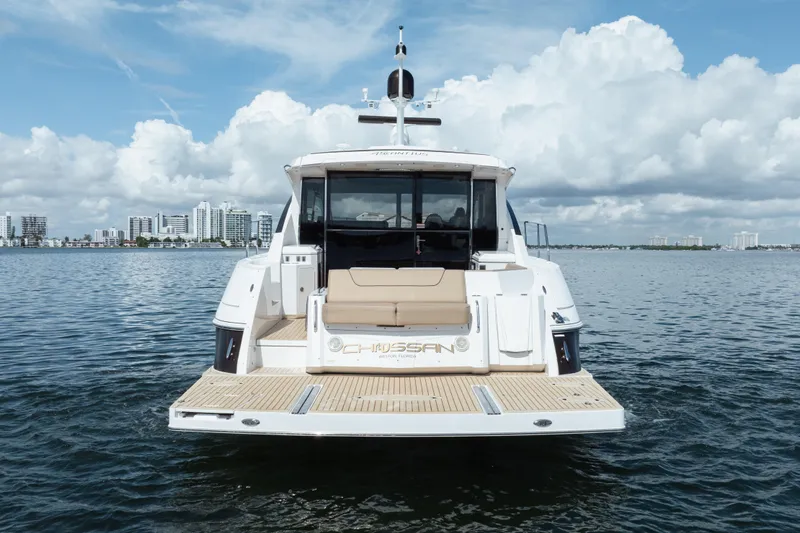 Chassan Yacht Photos Pics 2016 Cruisers Cantius yacht on water with city skyline in background.
