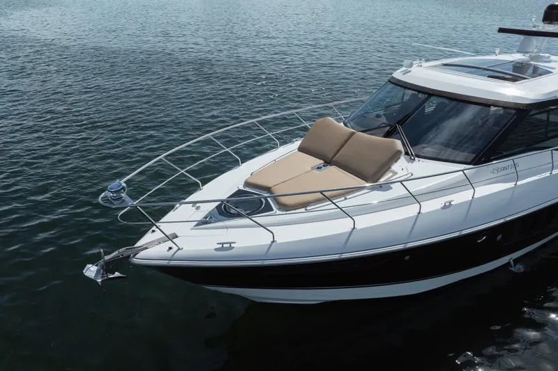 Chassan Yacht Photos Pics 2016 Cruisers Cantius yacht on calm water, featuring sleek design and sunbathing area.