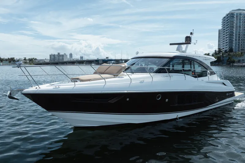 Chassan Yacht Photos Pics 2016 Cruisers Cantius yacht on water with city skyline in background.