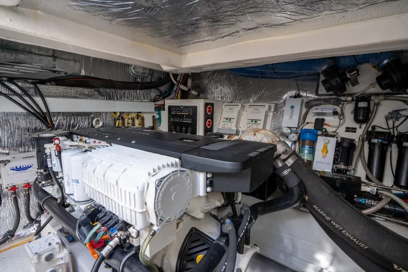 Chassan Yacht Photos Pics Engine room of a 2016 Cruisers Cantius yacht, showcasing mechanical components and systems.