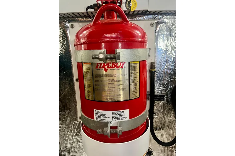 Chassan Yacht Photos Pics Red fire extinguisher mounted on a 2016 Cruisers Yachts 45 Cantius.