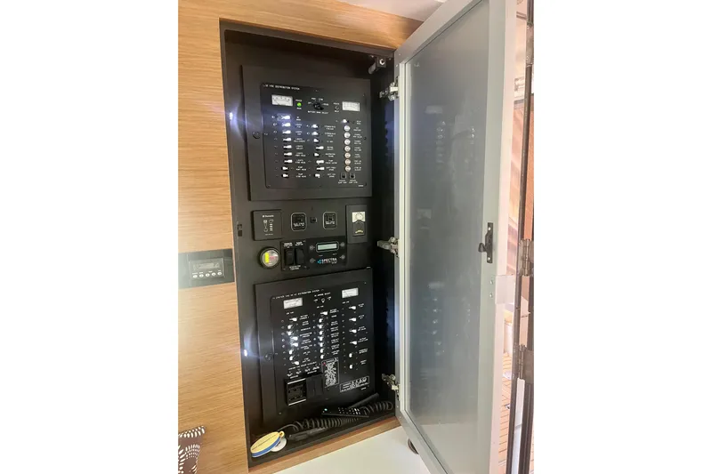 Chassan Yacht Photos Pics Electrical panel inside 2016 Cruisers Yachts 45 Cantius, featuring control switches and indicators.