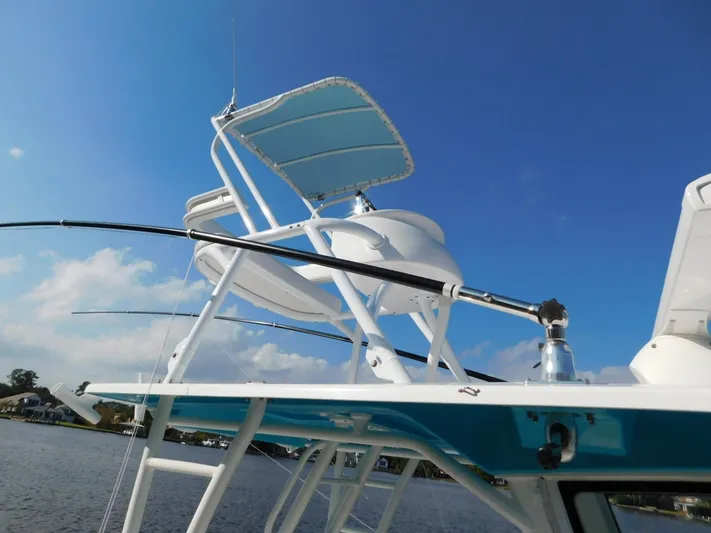  Yacht Photos Pics 2016 Everglades 355 Center Console boat with tower against blue sky.