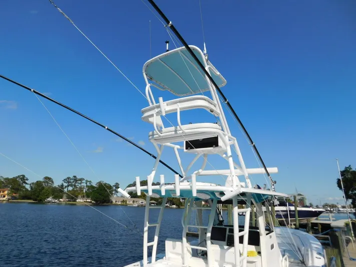  Yacht Photos Pics 2016 Everglades 355 Center Console boat with tower, docked on a sunny day.
