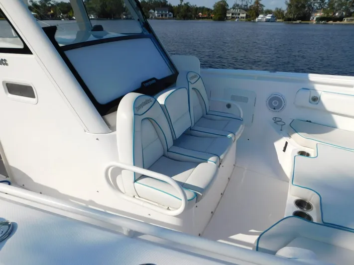  Yacht Photos Pics 2016 Everglades 355 Center Console boat interior with white seating and blue accents.