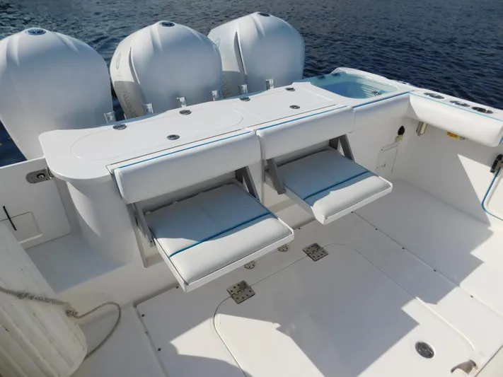  Yacht Photos Pics 2016 Everglades 355 Center Console boat with triple outboard engines and foldable seating.