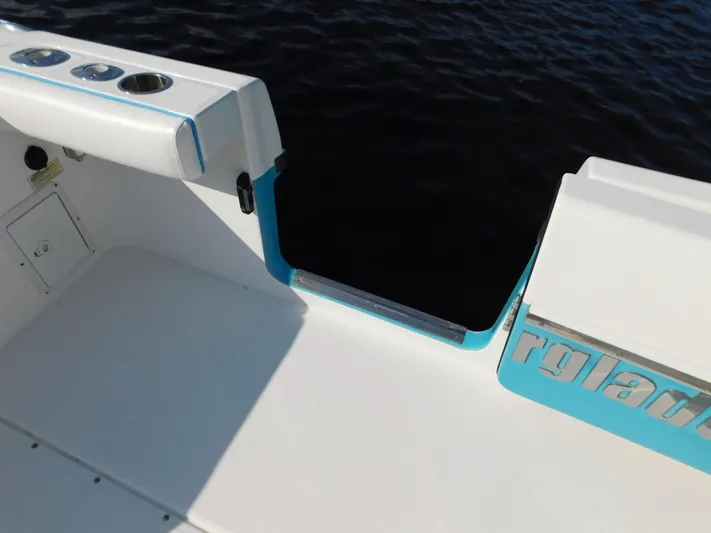  Yacht Photos Pics 2016 Everglades 355 Center Console boat, featuring sleek white and blue design, on water.