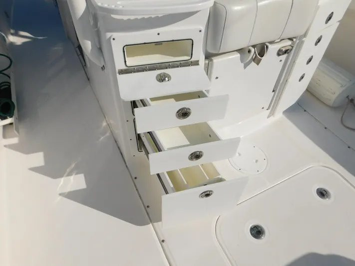  Yacht Photos Pics Open storage drawers on a 2016 Everglades 355 Center Console boat interior.