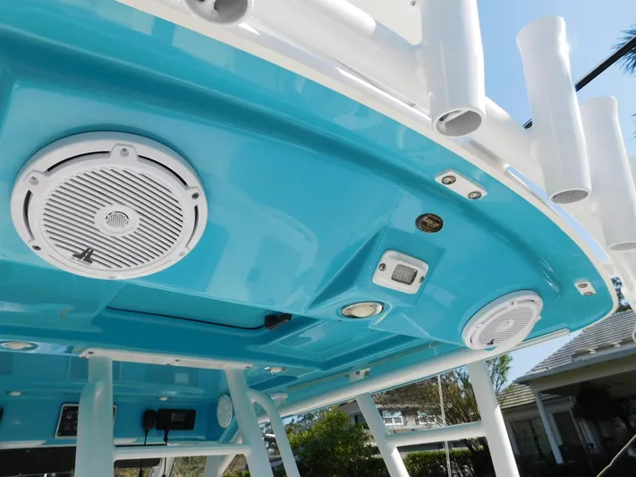  Yacht Photos Pics 2016 Everglades 355 Center Console boat with blue ceiling and speakers.