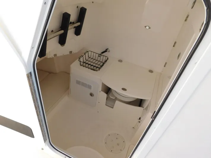  Yacht Photos Pics Interior of 2016 Everglades 355 Center Console boat, featuring a compact bathroom area.