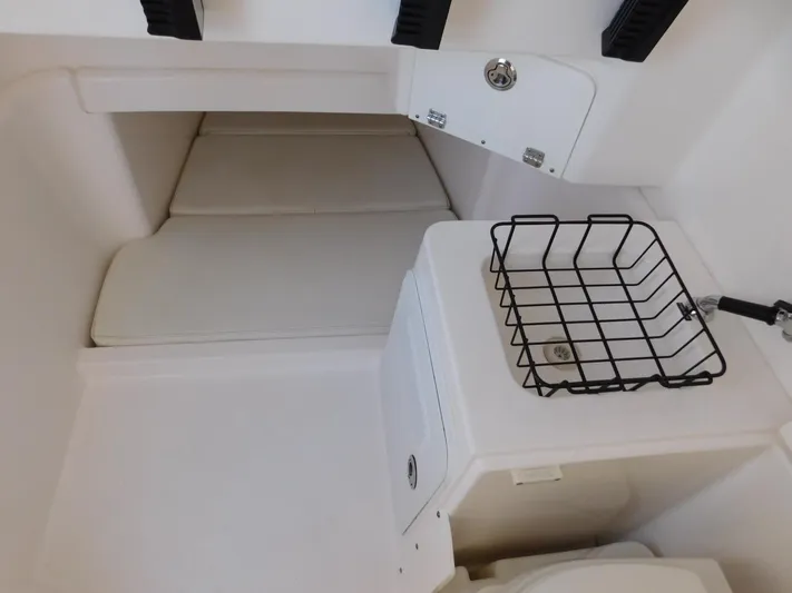  Yacht Photos Pics Interior of 2016 Everglades 355 Center Console boat with storage and seating area.