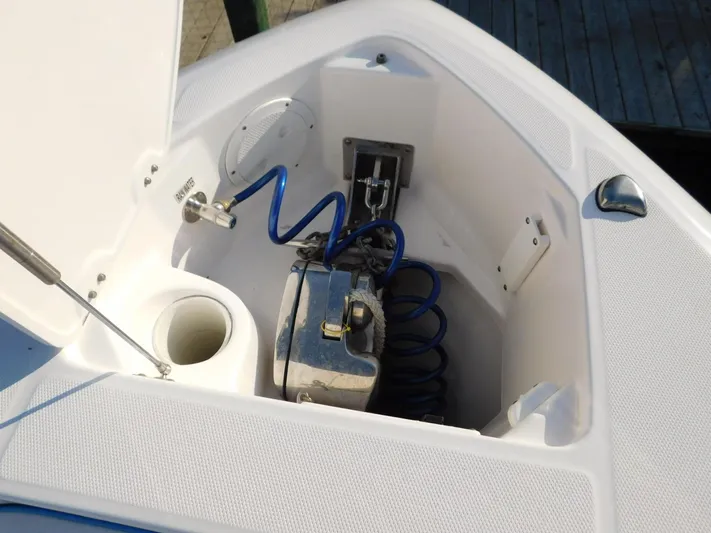  Yacht Photos Pics 2016 Everglades 355 Center Console anchor locker with coiled blue hose and winch system.