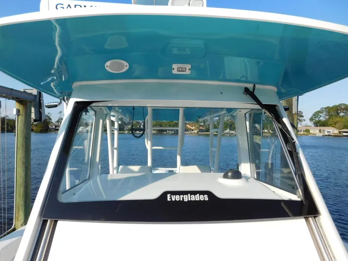  Yacht Photos Pics 2016 Everglades 355 Center Console boat on water, featuring sleek design and modern amenities.