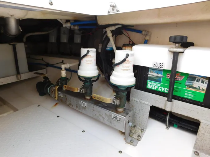  Yacht Photos Pics Engine compartment of a 2016 Everglades 355 Center Console boat, showing filters and battery.