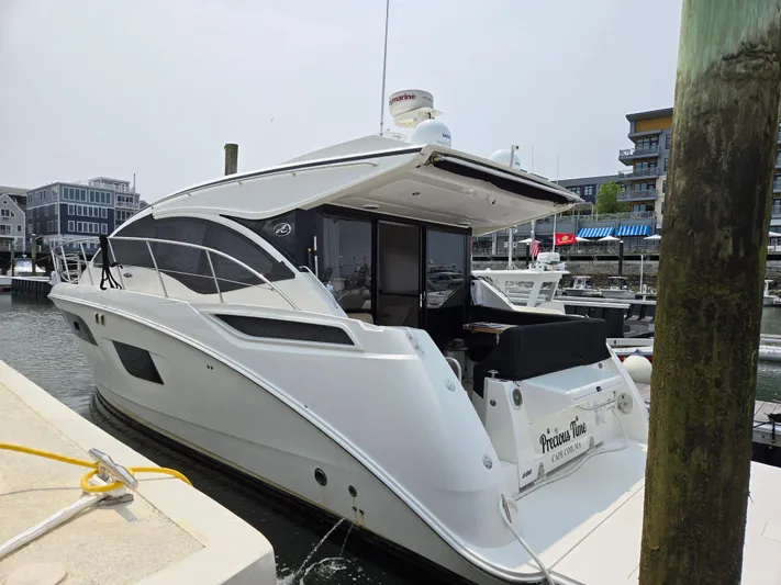 Precious Time Yacht Photos Pics 2017 Sea Ray Sundancer 400 yacht docked at marina, showcasing sleek design and modern features.