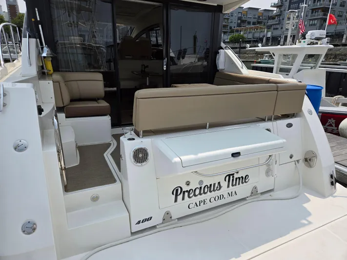 Precious Time Yacht Photos Pics 2017 Sea Ray Sundancer 400 yacht docked, featuring outdoor seating and "Precious Time" nameplate.