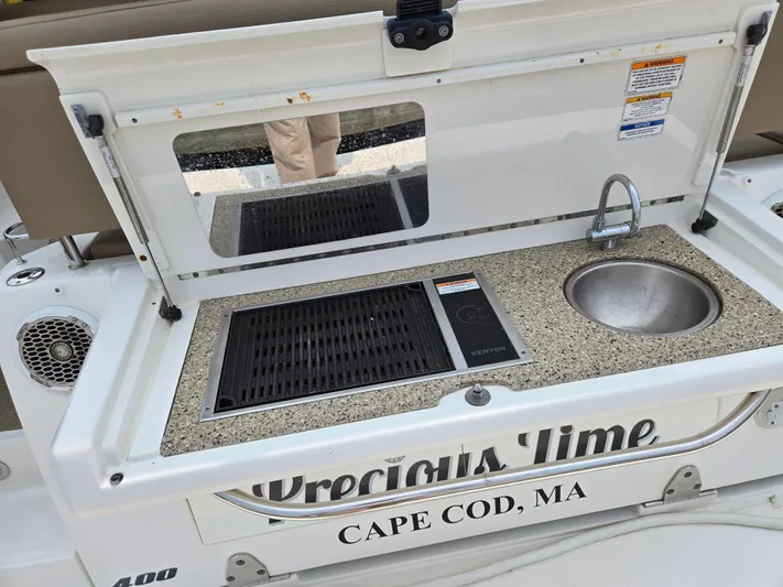 Precious Time Yacht Photos Pics Outdoor kitchenette on 2017 Sea Ray Sundancer 400 yacht, featuring sink and grill, Cape Cod, MA.