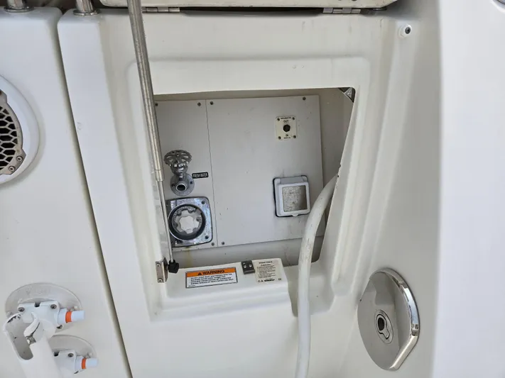 Precious Time Yacht Photos Pics 2017 Sea Ray Sundancer 400 utility compartment with hose and controls.