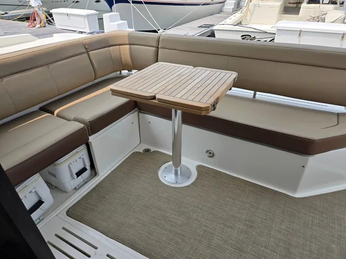 Precious Time Yacht Photos Pics 2017 Sea Ray Sundancer 400 yacht with beige seating and wooden table on deck.