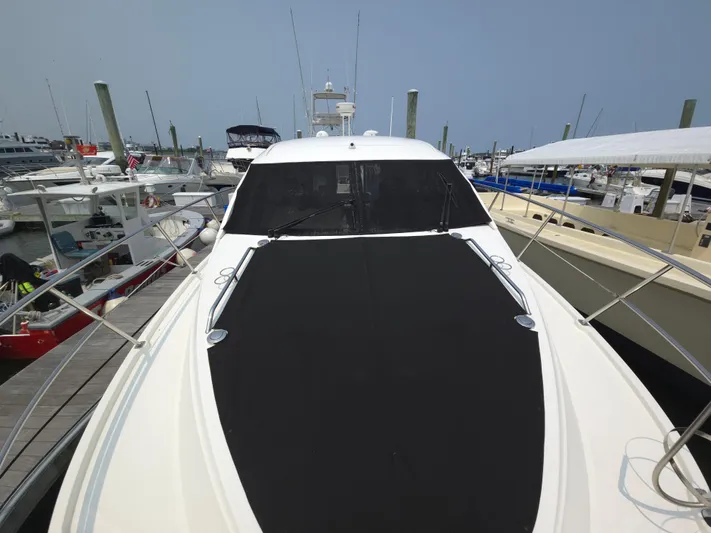 Precious Time Yacht Photos Pics 2017 Sea Ray Sundancer 400 yacht docked at a marina, showcasing sleek design and spacious deck.