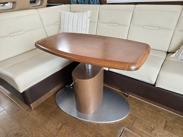 Precious Time Yacht Photos Pics Luxurious interior of 2017 Sea Ray Sundancer 400 with elegant wooden table and cream seating.