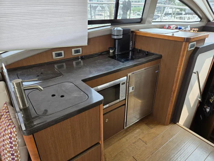 Precious Time Yacht Photos Pics 2017 Sea Ray Sundancer 400 yacht kitchen with modern appliances and sleek design.