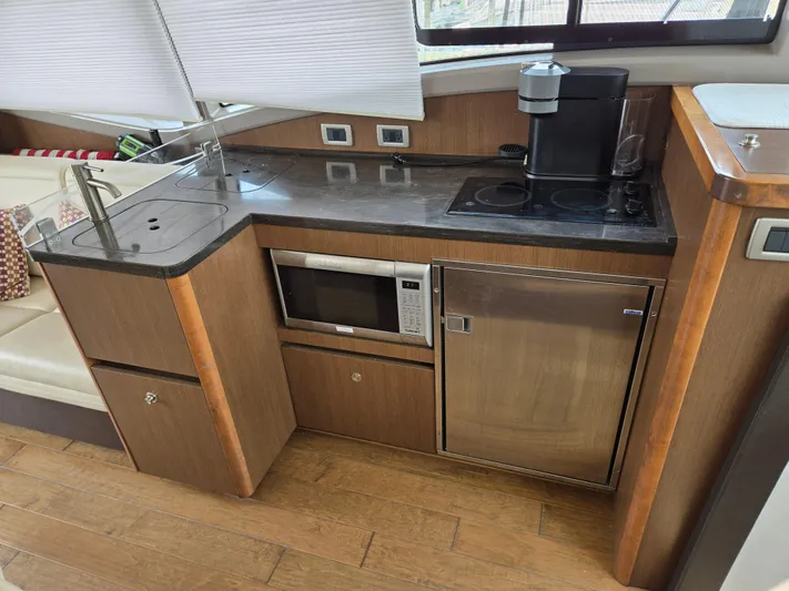 Precious Time Yacht Photos Pics 2017 Sea Ray Sundancer 400 galley with microwave, fridge, and coffee maker.