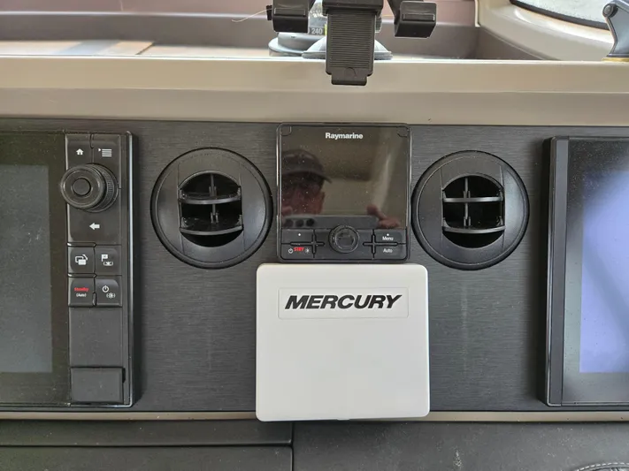 Precious Time Yacht Photos Pics Control panel of a 2017 Sea Ray Sundancer 400 with Mercury and Raymarine displays.