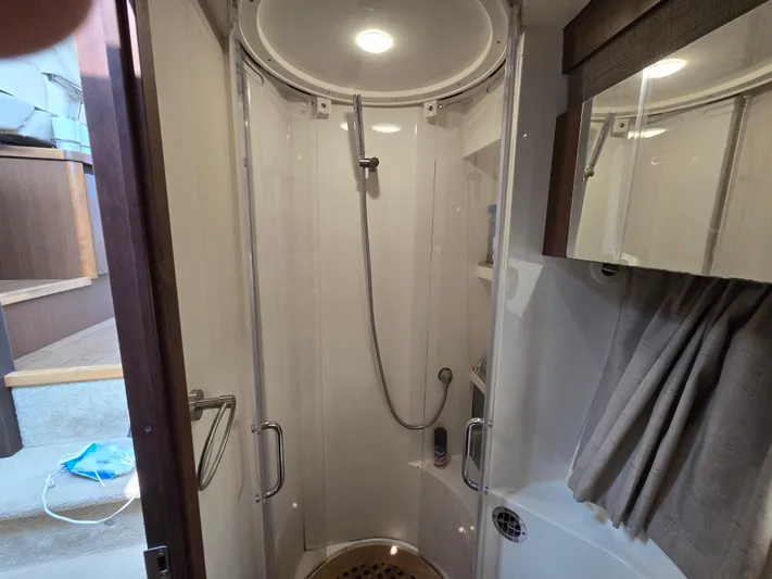 Precious Time Yacht Photos Pics Shower area inside 2017 Sea Ray Sundancer 400 yacht, featuring modern fixtures and lighting.