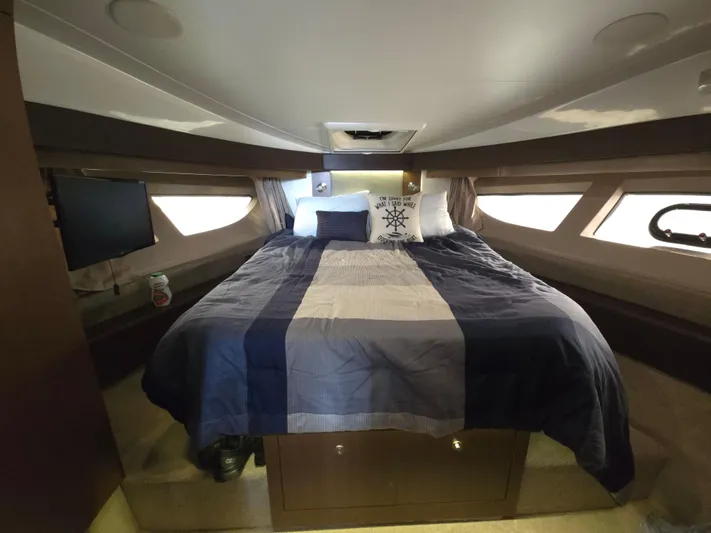 Precious Time Yacht Photos Pics Luxurious cabin interior of 2017 Sea Ray Sundancer 400 yacht with cozy bed and modern decor.