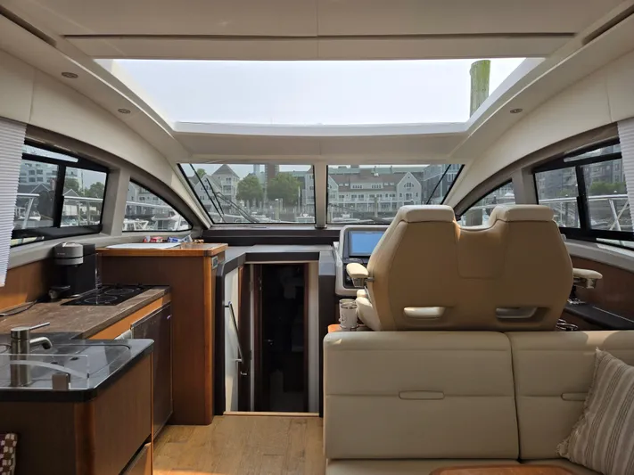 Precious Time Yacht Photos Pics Interior of 2017 Sea Ray Sundancer 400 yacht with modern kitchen and seating area.