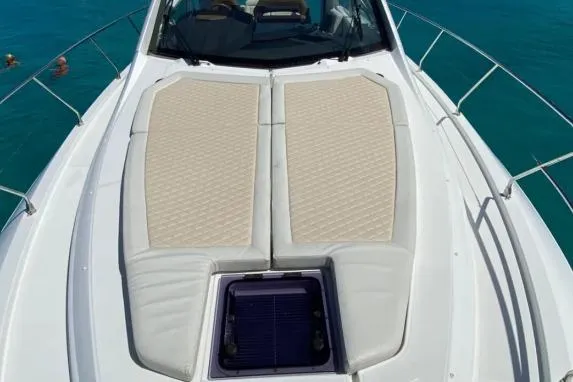 Sol Y Luna Yacht Photos Pics 2018 Beneteau 46 yacht with sunbathing deck, cruising on clear blue water.