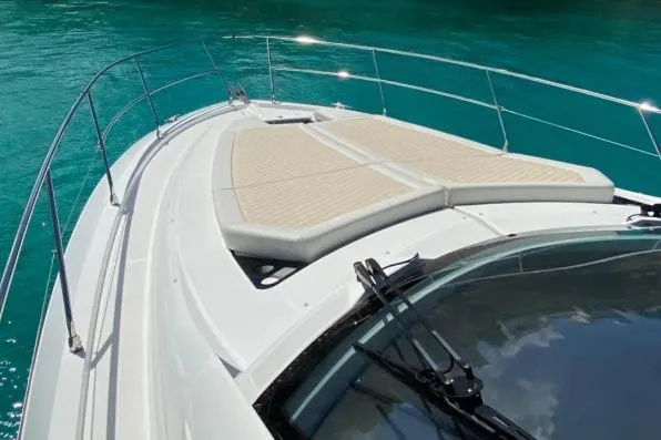 Sol Y Luna Yacht Photos Pics 2018 Beneteau 46 yacht deck with sunbathing area on turquoise water.