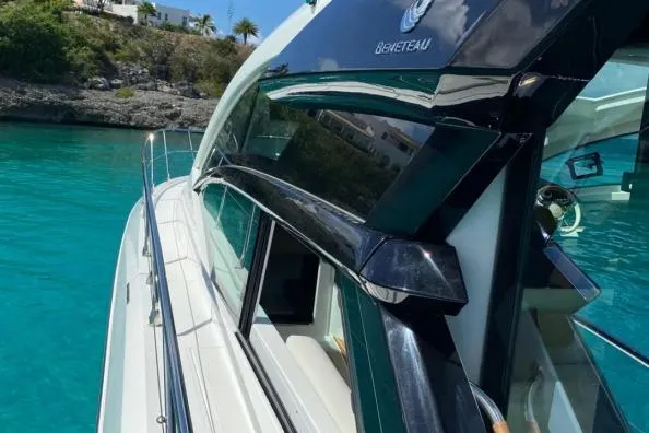 Sol Y Luna Yacht Photos Pics 2018 Beneteau 46 yacht on turquoise water, sleek design, sunny day.