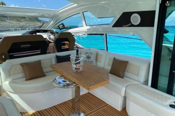 Sol Y Luna Yacht Photos Pics Luxurious interior of 2018 Beneteau 46 yacht with ocean view and elegant seating.
