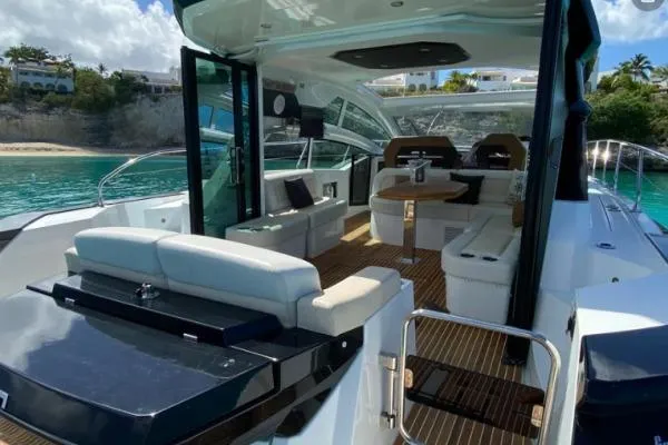 Sol Y Luna Yacht Photos Pics Luxurious 2018 Beneteau 46 yacht interior with elegant seating and scenic ocean view.