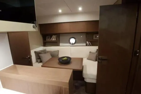 Sol Y Luna Yacht Photos Pics Interior of 2018 Beneteau 46 yacht with cozy seating and modern decor.